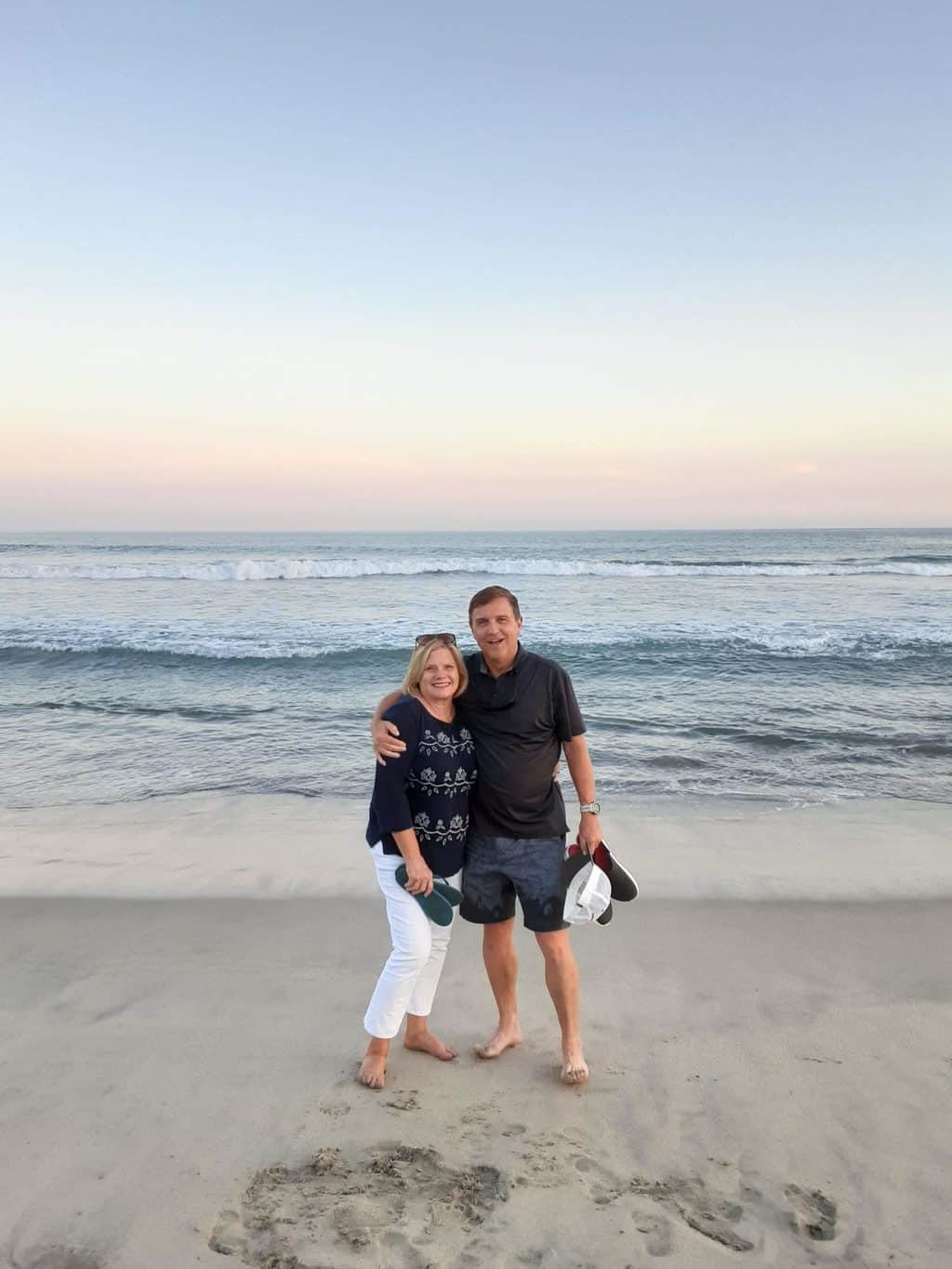 Rob and Lou Ann McMillen on the beach. They are SYMBIS facilitators.